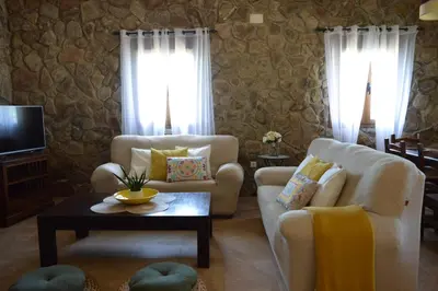 a living room with a couch and a table at Las Yucas in Conil de la Frontera