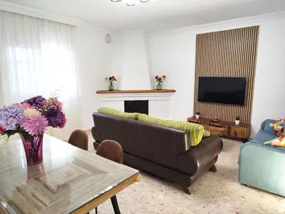 a living room with a couch and a table at Casa Elena in Conil de la Frontera
