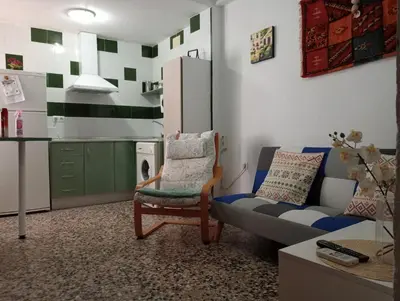 a living room with a couch and a chair at Casa Lomas in Arcos de la Frontera