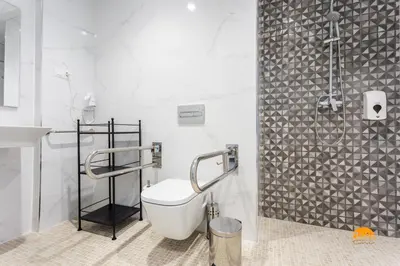 a white bathroom with a toilet and a shower at Delfin Azul 2 FREE PARKING by Cadiz Time in Cádiz