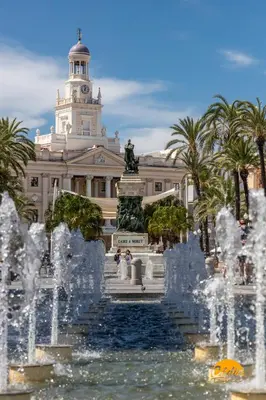a fountain in front of a building with a building at Delfin Azul 2 FREE PARKING by Cadiz Time in Cádiz
