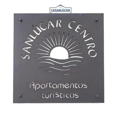 a sign for a water center with the sun and waves at Sanlucar Centro - Apartamento 2 in Sanlúcar de Barrameda