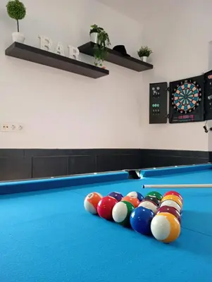 a pool table with a bunch of balls on it at La Almadraba in Chiclana de la Frontera
