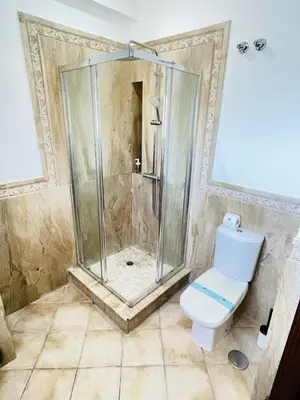 a bathroom with a shower and a toilet at La Almadraba in Chiclana de la Frontera