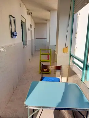 a blue table and chairs in a room at Azvalia Puerto Príncipe 2 in El Puerto de Santa María