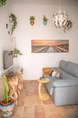 a living room with a couch and a table at Apartamento en pleno centro historico in Cádiz