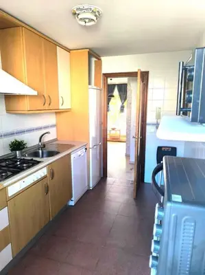 a kitchen with a sink and a counter top at Apartamento V CENTENARIO BEACH Sanlúcar in Sanlúcar de Barrameda