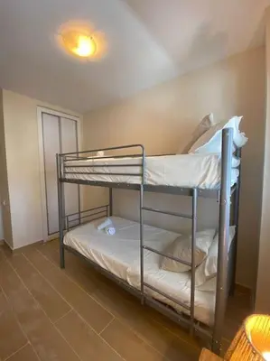 a room with two bunk beds in a room at Delfín Avenida Ha in Cádiz