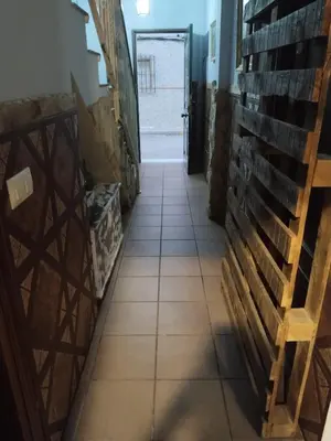 a hallway in a wine cellar with tile floors at Bienvenidos Villa Roki Para información seis3tres 0nueve 0nueve veinte in El Puerto de Santa María