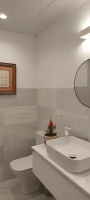 a white bathroom with a toilet and a sink at el 2 de Flamenco BajoA in Cádiz