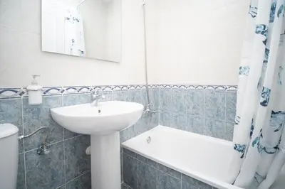 a bathroom with a sink and a toilet at Piso en el Barrio Alto in Sanlúcar de Barrameda