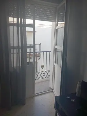 a room with a door open to a balcony at Leo's Home in Arcos de la Frontera