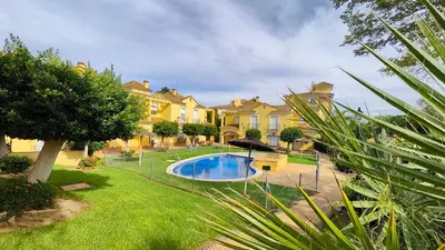 a house with a swimming pool in a yard at Pantoque Sani Ideal para familias in El Puerto de Santa María