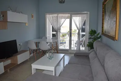 a living room with a couch and a table at Piso IBERIAN PREMIUM in Sanlúcar de Barrameda
