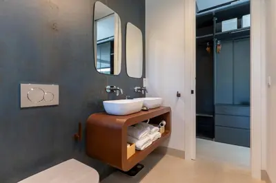 a bathroom with a sink and a mirror at Villa Gatán in Chiclana de la Frontera