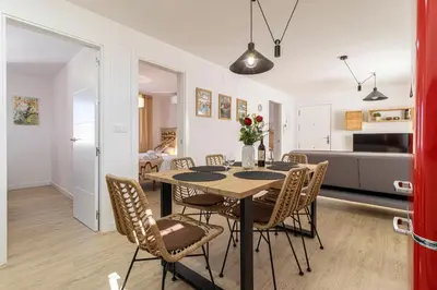 a dining room with a table and chairs at AdEva Céntrico 3 Habitaciones in Jerez de la Frontera