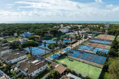 an aerial view of a city with two swimming pools at Pipoca's Beach in Novo Sancti Petri