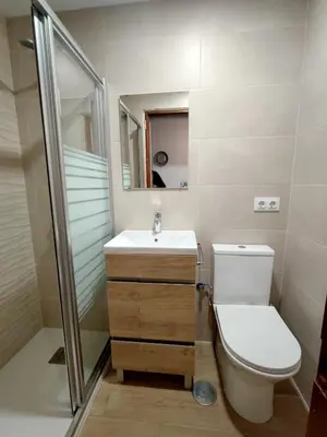 a bathroom with a toilet and a sink and a shower at Apto 5 personas con todo equipado in San Fernando