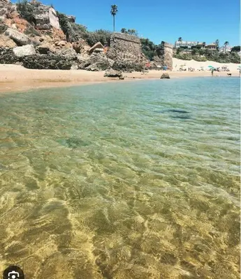 a view of a beach with crystal clear water at Piso Acogedor en pleno centro in El Puerto de Santa María