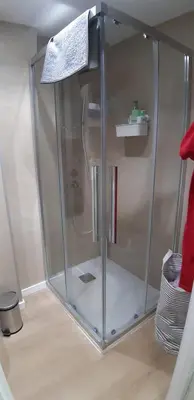 a shower with a glass door in a room at Piso del centro in Sanlúcar de Barrameda