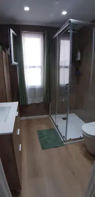 a bathroom with a shower and a toilet and a sink at Piso del centro in Sanlúcar de Barrameda