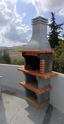a brick oven sitting on top of a roof at Rancho-Carita in Bornos