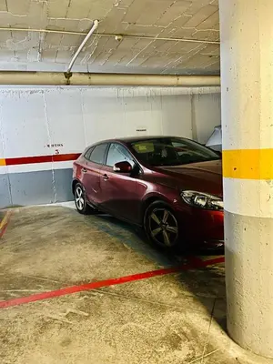 a car parked in a parking garage at patio de luja centro parking y piscina in El Puerto de Santa María