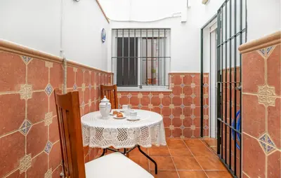 a small table in the corner of a room at 2 Bedroom Amazing Apartment In Chipiona in Chipiona