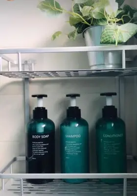 a shelf with two bottles of laundry detergent at Una casa en el lago in Arcos de la Frontera