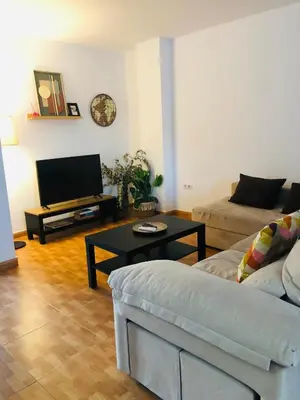 a living room with a couch and a coffee table at Una casa en el lago in Arcos de la Frontera