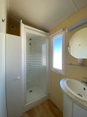 a bathroom with a shower and a sink at Casita la ilusión in Conil de la Frontera