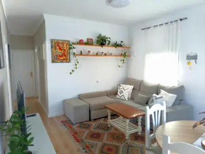 a living room with a couch and a table at Villasultana 1 in Chipiona