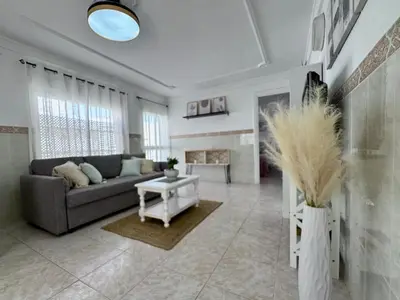 a living room with a couch and a fireplace at El Cerro de Villasultana, a 3min a pie de playa VUTCA21313 in Chipiona