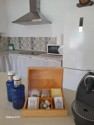 a kitchen with a stainless steel counter top at Acogedor loft a 30 minutos de la playa y montaña in Lebrija