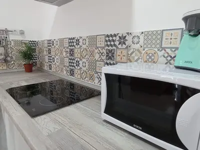 a box of food sitting on top of a kitchen counter at Acogedor loft a 30 minutos de la playa y montaña in Lebrija