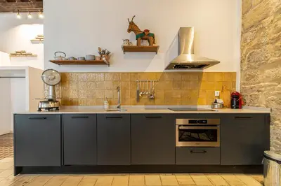 a kitchen with a sink and a stove at Allo Apartments Amargura II Centro Loft in Jerez de la Frontera