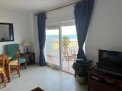 a living room with a view of the ocean at Apartamento Ana in El Puerto de Santa María
