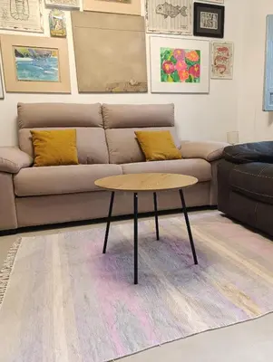 a living room with a couch and a coffee table at Mina25 by 7Escalones in Rota