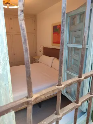 a bedroom with two bunk beds and a window at Mina25 by 7Escalones in Rota