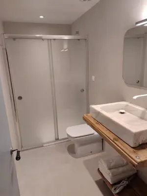 a bathroom with a shower and a sink and a toilet at Mina25 by 7Escalones in Rota
