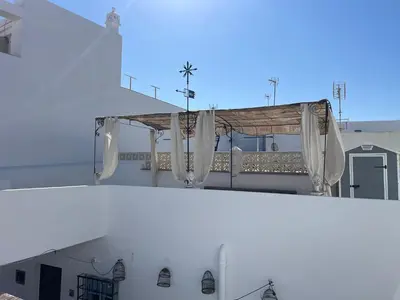 a view of a white building with a altar at Mina25 by 7Escalones in Rota