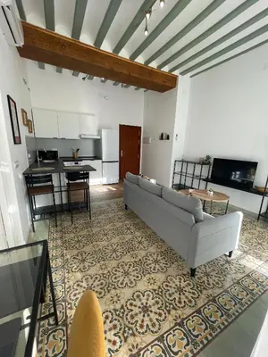 two towels sitting on a bed in a room at Apartamento Gallo Azul in Jerez de la Frontera