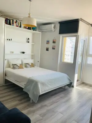 a bedroom with a bed and a window at Azvalia estudio Valdelagrana in El Puerto de Santa María