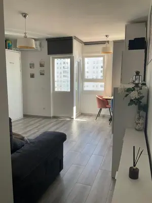 a living room with a couch and a table at Azvalia estudio Valdelagrana in El Puerto de Santa María