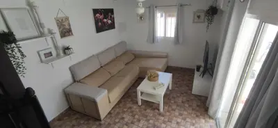 a living room with a couch and a table at VillaConil in Conil de la Frontera
