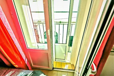 an open window with a view of a building at Milagros Central Apartments in El Puerto de Santa María