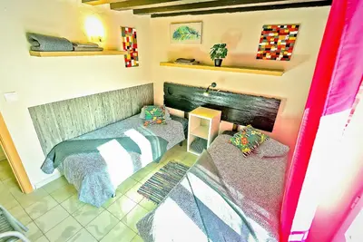 a small room with a bed and a fireplace at Milagros Central Apartments in El Puerto de Santa María