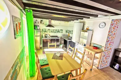 a kitchen with a table and chairs in a room at Milagros Central Apartments in El Puerto de Santa María