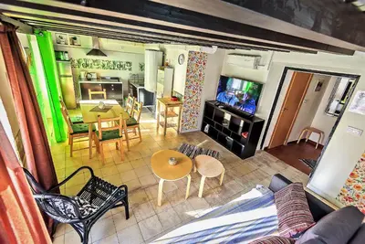 an aerial view of a living room and dining room at Milagros Central Apartments in El Puerto de Santa María