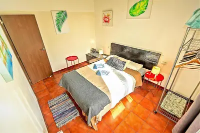 a bedroom with a large bed in a room at Milagros Central Apartments in El Puerto de Santa María